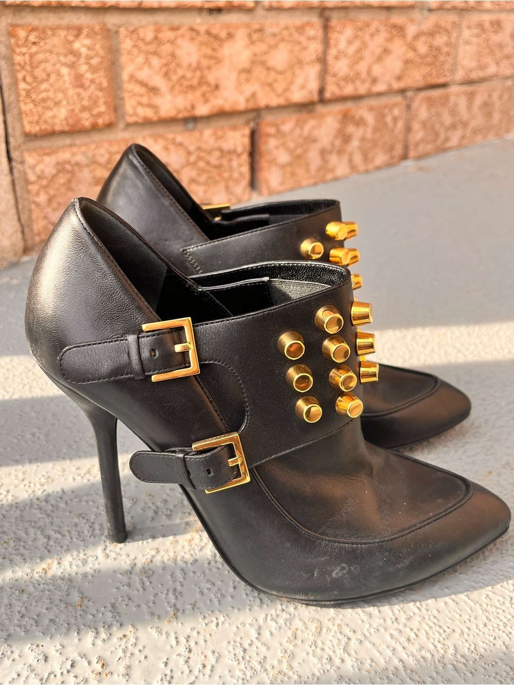 GUCCI Black Leather High-Heel Ankle Boots with Gold Stud Details